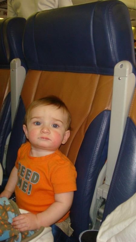 Seatback is upright and Tray is Stowed